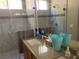 Bathroom with shower and granite countertops at 3418 Cinnamon Creek Ave, North Las Vegas, NV 89031