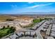 Wide aerial view of community near golf course and mountains at 4746 Se Argent Hills Ave, Pahrump, NV 89061