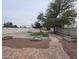 Landscaped backyard with a patio and trees at 8701 Shady Pines Dr, Las Vegas, NV 89143