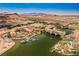 Aerial view of Lake Las Vegas community with lake, resort, and bridge at 1254 Calcione Dr, Henderson, NV 89011