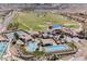 Aerial view of Lake Las Vegas Sports Club with pools, tennis courts, and golf course at 1254 Calcione Dr, Henderson, NV 89011