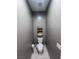 Small powder room with toilet and floating shelves at 690 Coastal Lagoon St, Henderson, NV 89002