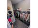 Large walk-in closet with ample shelving and hanging space at 690 Coastal Lagoon St, Henderson, NV 89002