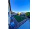 Landscaped backyard with grassy area and gravel border at 690 Coastal Lagoon St, Henderson, NV 89002