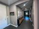 Bright and spacious entryway with dark gray floors at 690 Coastal Lagoon St, Henderson, NV 89002