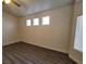 Bright bedroom with multiple windows and hardwood floors at 8240 Aurora Peak Ave, Las Vegas, NV 89131