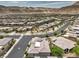 Aerial view of a house and surrounding neighborhood, showcasing the community's layout and landscape at 9928 Regency Square Ave, Las Vegas, NV 89148