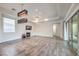 Bright living room featuring hardwood floors and a fireplace at 9928 Regency Square Ave, Las Vegas, NV 89148