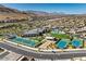 Aerial view of community with pool, tennis courts, and clubhouse at 9928 Regency Square Ave, Las Vegas, NV 89148