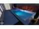 Inviting rectangular pool with water features at night at 1890 Eagle Flight Ln, Henderson, NV 89012