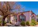 Side view of a pink manufactured home with landscaping at 4585 Sonia Rose Ln, Las Vegas, NV 89122