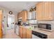 Kitchen with wood cabinets and stainless steel appliances at 4585 Sonia Rose Ln, Las Vegas, NV 89122