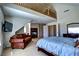 Spacious main bedroom with a sitting area and fireplace, featuring a loft area above at 9209 Tudor Park Pl, Las Vegas, NV 89145