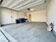 Spacious garage with ample storage and overhead door at 7253 Blooming Jasmine Ave, Las Vegas, NV 89117