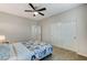 Bedroom with ceiling fan, double doors, and carpet at 201 White Mule Ave, Las Vegas, NV 89148