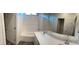 Bathroom with double vanity, soaking tub, and shower at 10782 Far Country Ave, Las Vegas, NV 89129