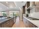 Modern kitchen with wood cabinets, island, and high-end appliances at 22 Via Del Fiume, Henderson, NV 89011