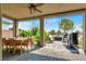 Covered patio with dining area and built-in grill at 5119 E Long Leaf Ct, Pahrump, NV 89061