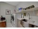 Laundry room with a farmhouse sink and shelving at 8286 Skye Gorge St, Las Vegas, NV 89166