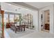 Elegant dining room features a wood table and large windows at 8286 Skye Gorge St, Las Vegas, NV 89166