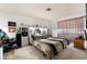 Main bedroom with king-size bed and mirrored headboard at 528 Close Ave, Henderson, NV 89011