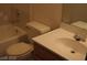 Bathroom with tub, toilet, and vanity with sink at 1912 Nebula Dr, Las Vegas, NV 89115