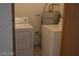 Laundry room with washer, dryer, and water heater at 1912 Nebula Dr, Las Vegas, NV 89115