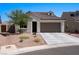 Single-story home with a two-car garage and desert landscaping at 1388 Mariposa Way, Mesquite, NV 89027