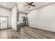 Open living room with wood-look floors and ceiling fan at 101 S Royalite St, Sandy Valley, NV 89019