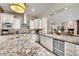 Gourmet kitchen boasts granite counters, stainless steel appliances, and custom cabinetry at 4231 San Alivia Ct, Las Vegas, NV 89141