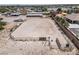 Aerial view of riding arena with stables and surrounding fencing at 5901 W Washburn Rd, Las Vegas, NV 89130