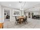 Bright dining room features a wooden table with seating for four and access to the kitchen at 5901 W Washburn Rd, Las Vegas, NV 89130