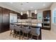 Modern kitchen with dark cabinetry, stainless steel appliances, and an island at 120 Los Cabos Dr # 301, Las Vegas, NV 89144