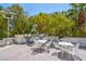 Outdoor kitchen and dining area with white tables and chairs at 222 Karen Ave # 1005, Las Vegas, NV 89109