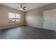 Bright living room with gray flooring, ceiling fan, and window at 45 Maleena Mesa St # 1711, Henderson, NV 89074