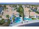 Aerial view of house with pool and mountain backdrop at 8100 Lake Hills Dr, Las Vegas, NV 89128