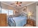 Bedroom with wrought iron bed frame and window seat at 220 Du Fort Ave, Henderson, NV 89002