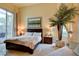 Spacious bedroom with large bed, decorative artwork and plenty of light at 2877 Paradise Rd # 104, Las Vegas, NV 89109