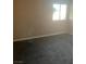 Simple bedroom with neutral walls and carpeting at 6117 Rosalita Ave, Las Vegas, NV 89108