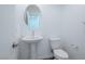 Simple pedestal sink and toilet in guest bathroom at 6509 Cinnamon Hazelnut St, North Las Vegas, NV 89084