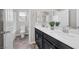 Bathroom with double vanity and dark cabinets at 6919 Denio Island St # 0, North Las Vegas, NV 89084