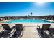 Relaxing pool area with lounge chairs and stunning views at 9101 Alta Dr # 16, Las Vegas, NV 89145