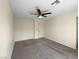 Spacious carpeted bedroom with ceiling fan at 2621 Polar White Ave, North Las Vegas, NV 89086