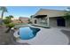 Inviting freeform pool and spa with grassy backyard at 6064 Alpine Estates Cir, Las Vegas, NV 89149