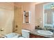 Bathroom with tub, granite countertop, and built-in shelving at 6527 Lokai Ave, Las Vegas, NV 89130