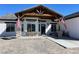 Farmhouse exterior with large covered porch and flag at 1660 Princeton Cir, Pahrump, NV 89060