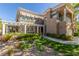 Two-story home with a covered entryway, landscaping, and a two-car garage at 801 Dana Hills Ct # 102, Las Vegas, NV 89134