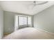 Bedroom with bay window, ceiling fan, and neutral walls at 9100 Firebird Dr, Las Vegas, NV 89134