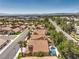 Community overview featuring homes with tile roofs and lush landscaping at 2005 Ridge Rim St, Las Vegas, NV 89117