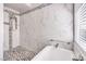 Elegant bathroom with marble shower and soaking tub at 2005 Ridge Rim St, Las Vegas, NV 89117